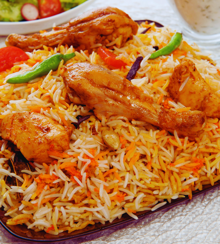 “Fragrant Chicken Biryani with basmati rice and herbs”